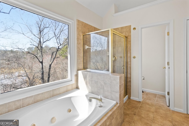 full bath with a stall shower, a tub with jets, and tile patterned floors