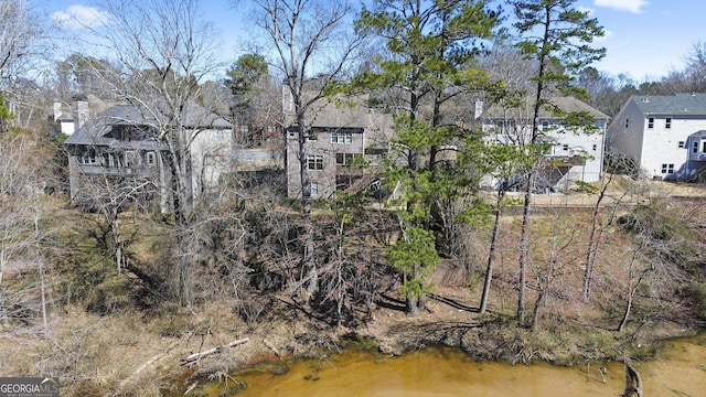 exterior space featuring a residential view and a water view