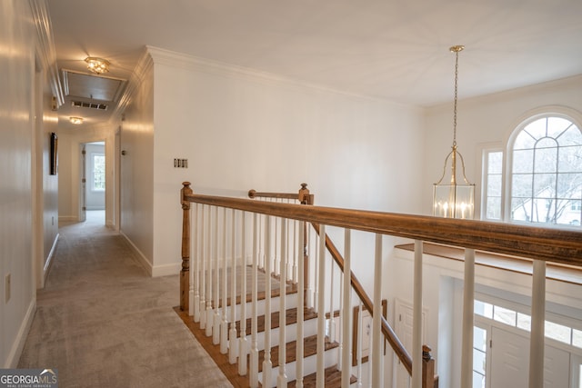 hall featuring crown molding, visible vents, light carpet, an upstairs landing, and baseboards