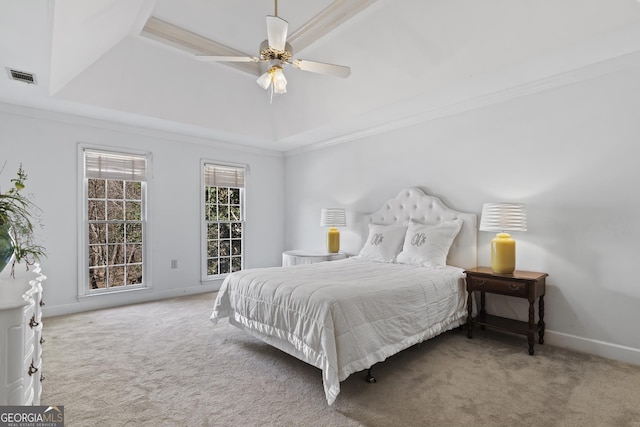 carpeted bedroom with crown molding, a raised ceiling, visible vents, a ceiling fan, and baseboards