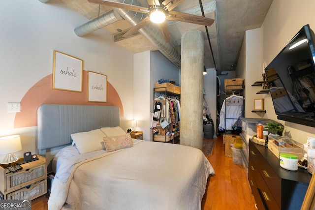 bedroom with wood finished floors