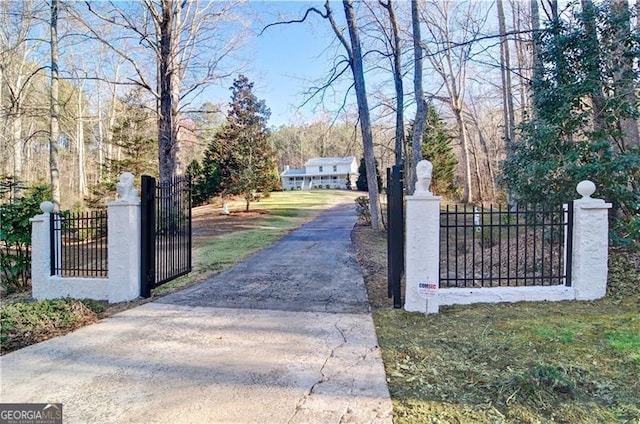 view of gate featuring fence