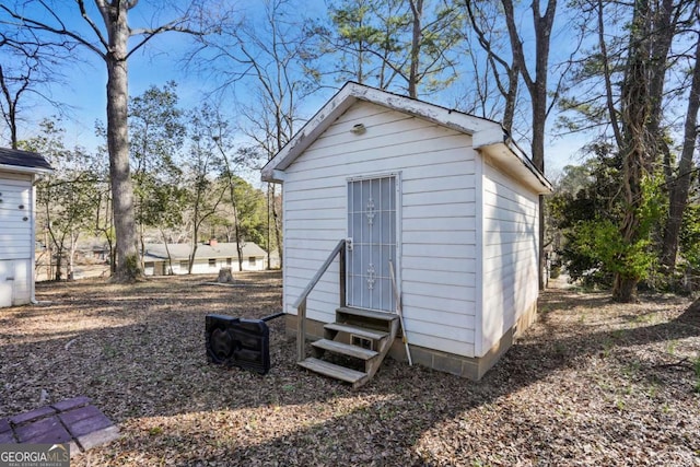 view of outdoor structure featuring entry steps and an outdoor structure