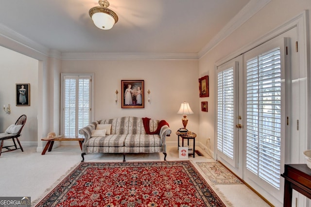 carpeted living room featuring baseboards, crown molding, and french doors