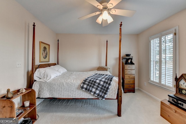 bedroom with carpet floors, baseboards, and a ceiling fan