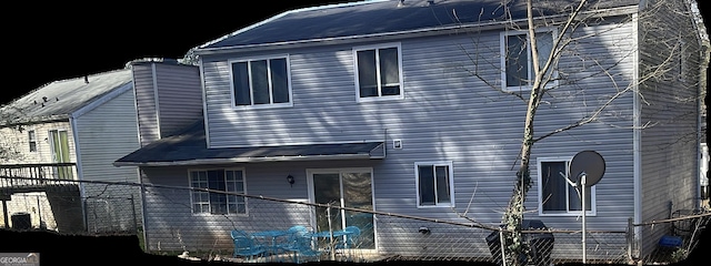 view of front of home featuring fence