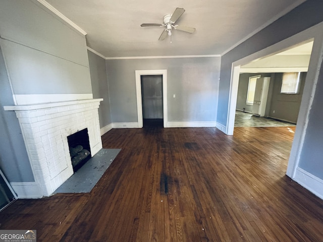 unfurnished living room with hardwood / wood-style flooring, a fireplace, baseboards, and crown molding