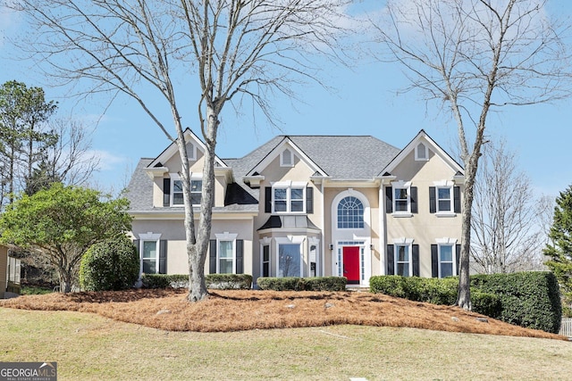 view of front of home featuring a front lawn and stucco siding