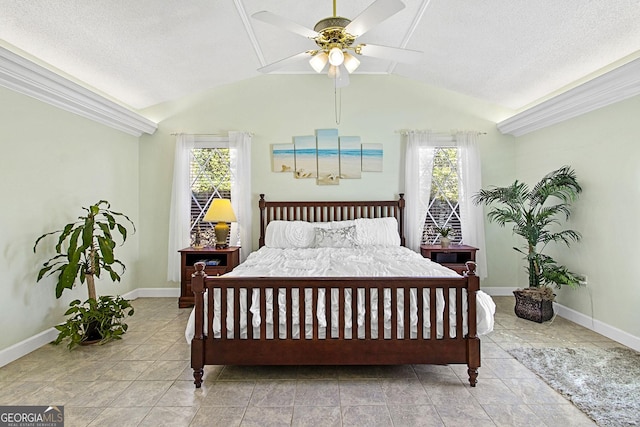 tiled bedroom featuring lofted ceiling, ceiling fan, multiple windows, and baseboards