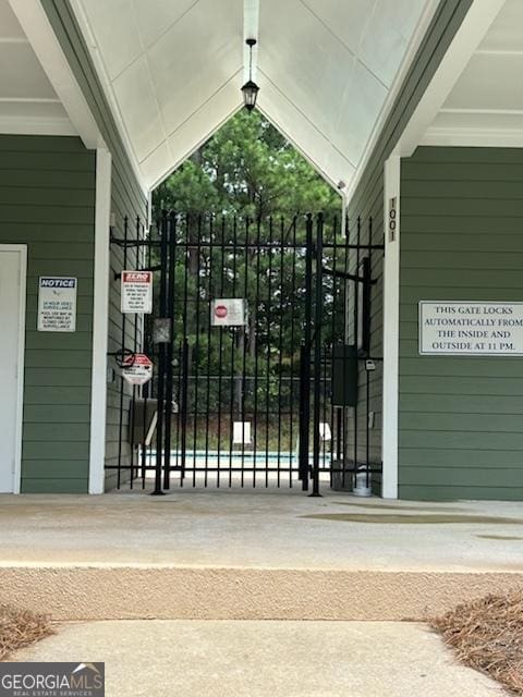 view of gate featuring fence