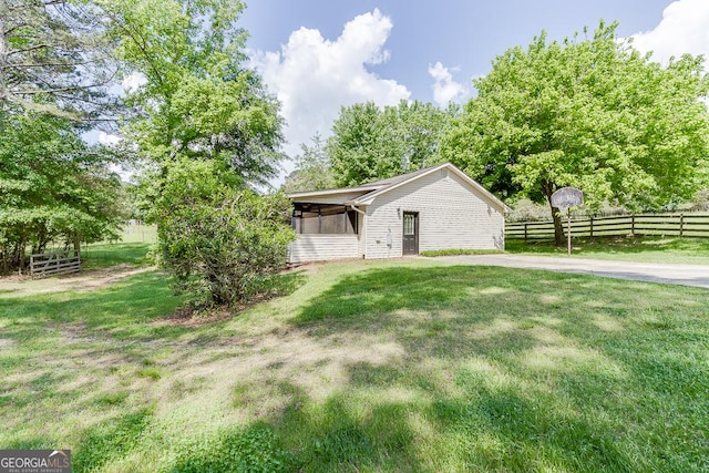 view of yard with a sunroom