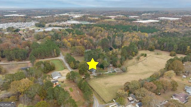 aerial overview of property's location with a forest