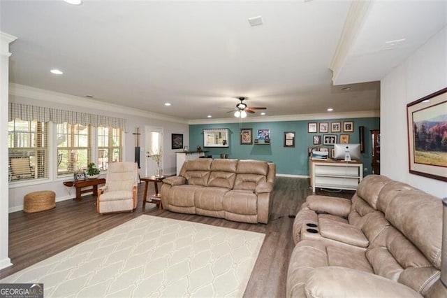 living room with baseboards, ornamental molding, wood finished floors, and recessed lighting