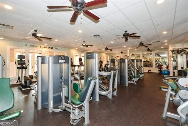 exercise room featuring visible vents and a paneled ceiling