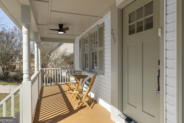 balcony featuring ceiling fan and a porch