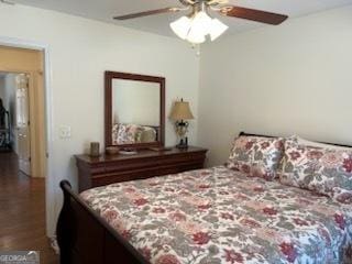 bedroom featuring a ceiling fan and wood finished floors