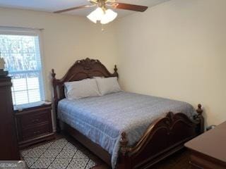 bedroom with multiple windows and ceiling fan