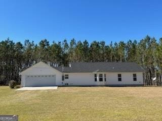 ranch-style home with a front yard and an attached garage