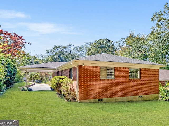 view of property exterior featuring a shingled roof, crawl space, brick siding, and a lawn