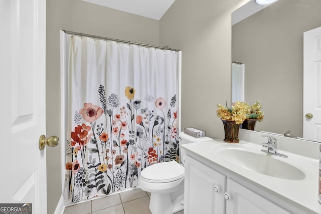 bathroom featuring toilet, a shower with curtain, tile patterned flooring, and vanity