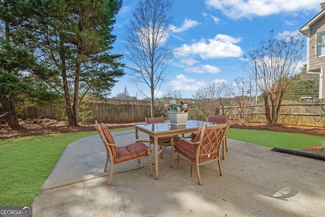 view of patio / terrace featuring outdoor dining space and a fenced backyard