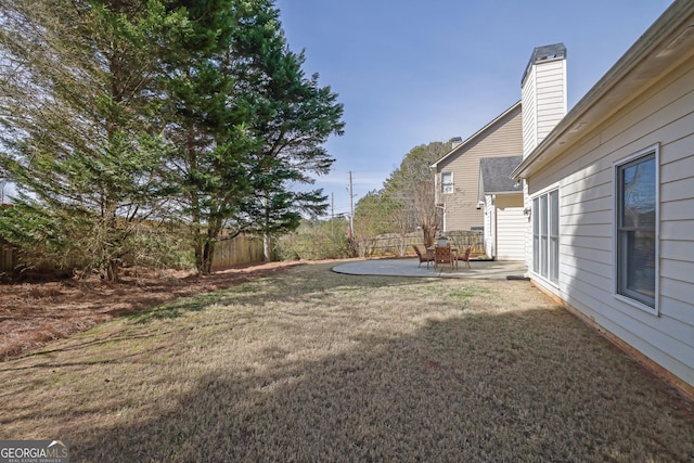 view of yard featuring a patio area and fence