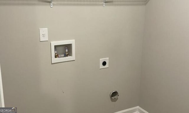 laundry area featuring baseboards, laundry area, washer hookup, and hookup for an electric dryer