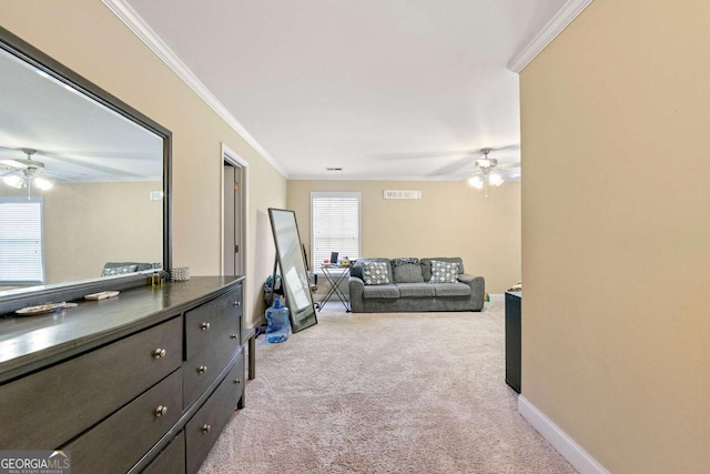 carpeted living area featuring ceiling fan, baseboards, and crown molding