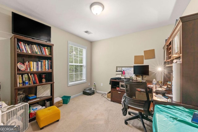 office space featuring carpet flooring, visible vents, and baseboards