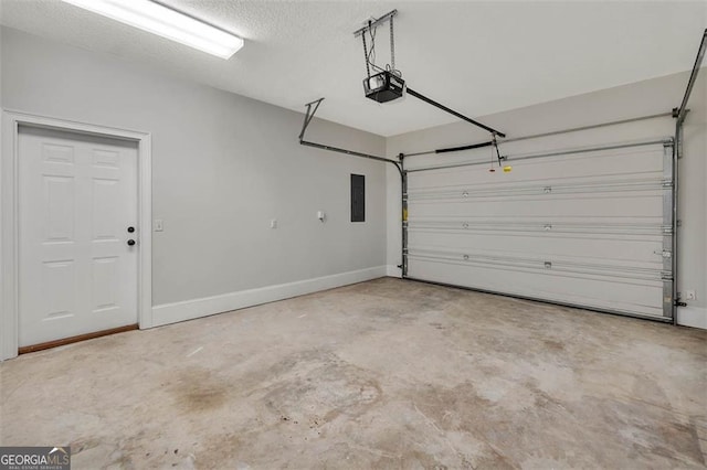 garage featuring baseboards, electric panel, and a garage door opener