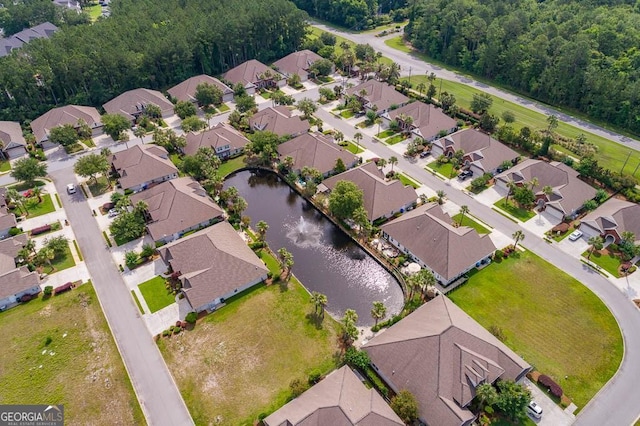 bird's eye view featuring a water view and a residential view