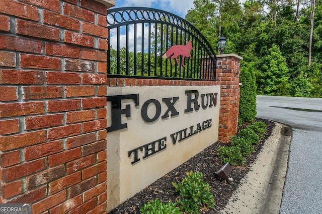 community sign with a gate