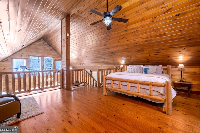 bedroom with lofted ceiling, wood walls, wood-type flooring, and wood ceiling