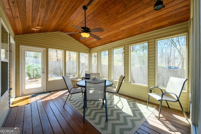 sunroom with lofted ceiling, wooden ceiling, and plenty of natural light