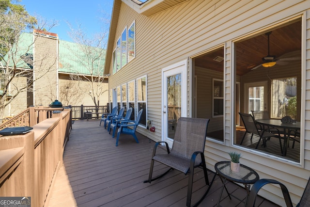 wooden terrace with ceiling fan