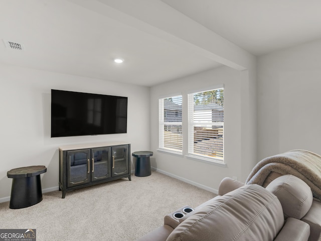 carpeted living area with baseboards, visible vents, and recessed lighting