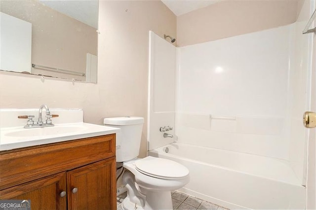 bathroom with tub / shower combination, vanity, toilet, and tile patterned floors