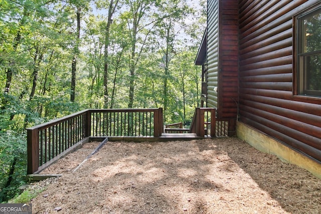 deck with a wooded view