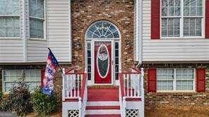 property entrance featuring brick siding