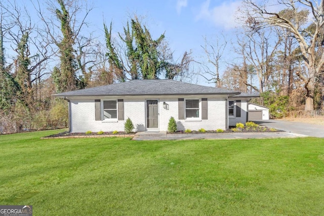 single story home featuring a front lawn, brick siding, and aphalt driveway