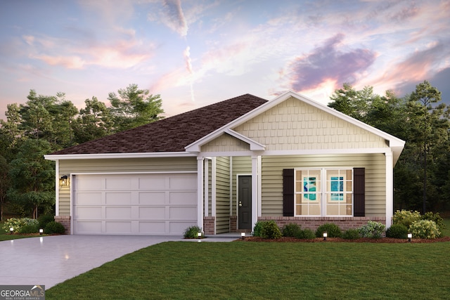 view of front of house featuring a garage, a yard, brick siding, and concrete driveway