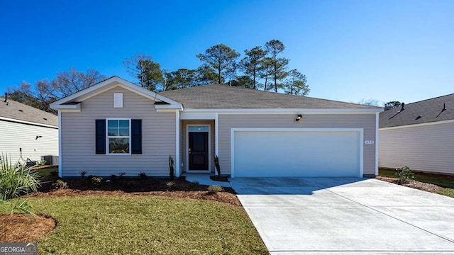 ranch-style home with a garage, a front yard, driveway, and central AC unit