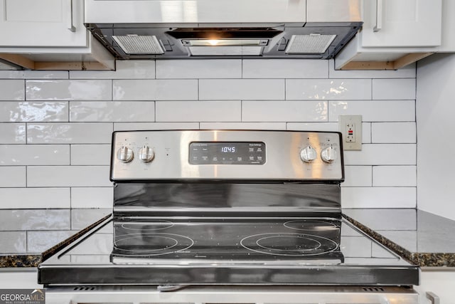 room details featuring white cabinetry, stainless steel electric stove, and decorative backsplash