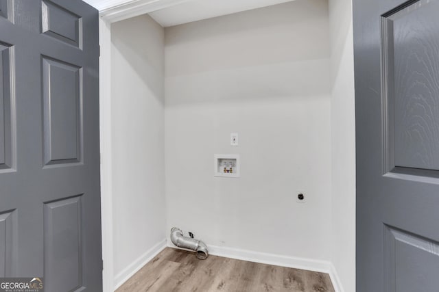 laundry area with hookup for an electric dryer, laundry area, washer hookup, wood finished floors, and baseboards