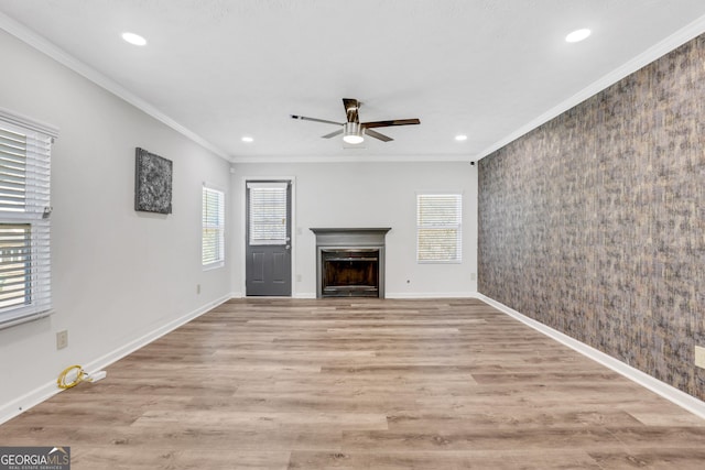 3242 Kingswood Gln, Decatur, GA 30034 - unfurnished living room featuring a wealth of natural light, a fireplace, ceiling fan, and ornamental molding