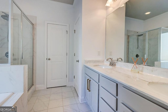 full bathroom featuring crown molding, double vanity, a sink, a shower stall, and a bath