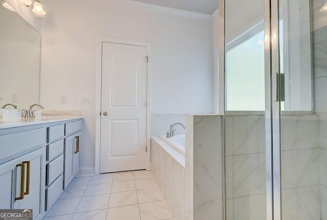 bathroom with ornamental molding, tile patterned floors, vanity, and a bath