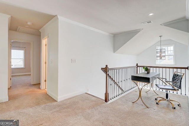 corridor with attic access, visible vents, a wealth of natural light, and an upstairs landing