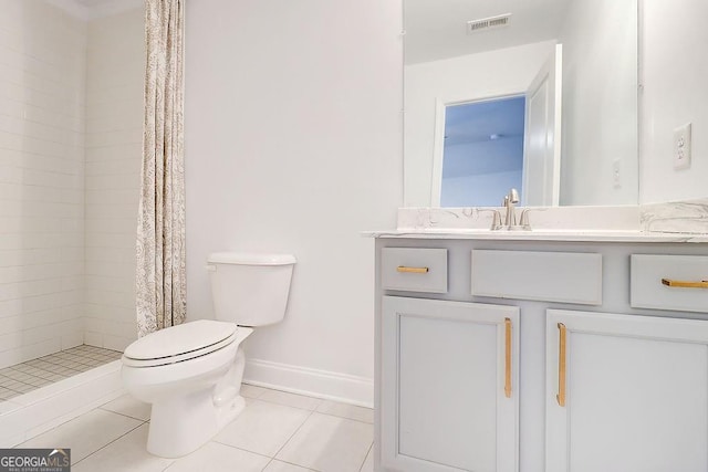 bathroom featuring visible vents, toilet, a stall shower, vanity, and tile patterned flooring