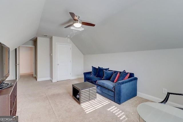 carpeted living area with lofted ceiling, visible vents, ceiling fan, and baseboards